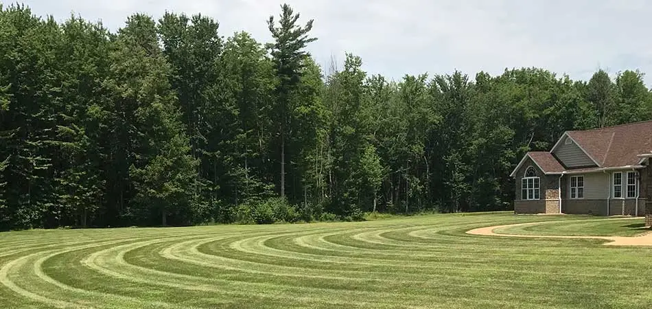 A proper aeration and overseeding in a lawn of this Conneaut property.